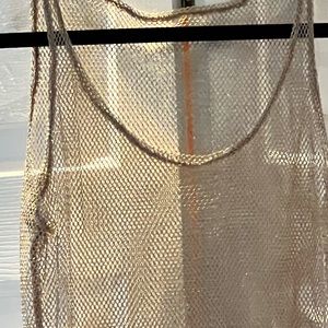 Long swimsuit cover up in Gold shimmer mesh. The black mesh cover up is free.